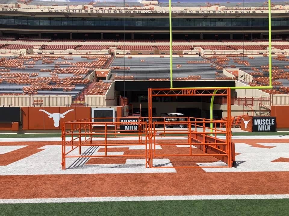 Custom orange Bevo pen on the field at the University of Texas stadium